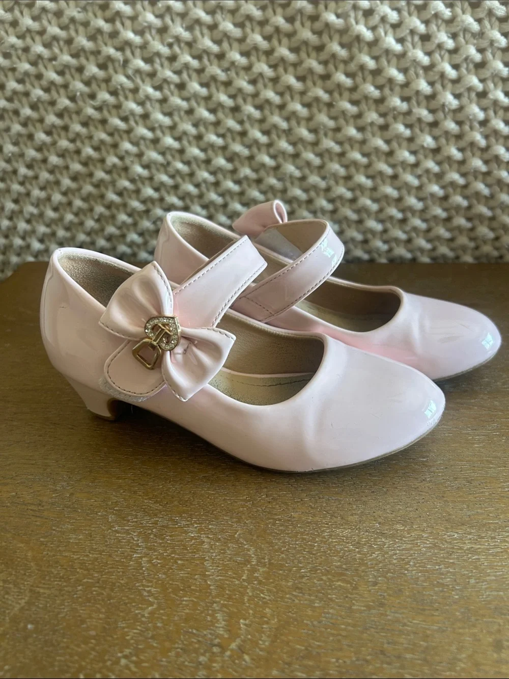 Pale pink shiny Maryjane heels with bow clasp. Perfect for fancy or dress up!
